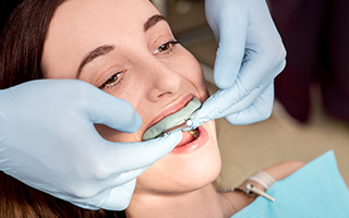 Woman being fitted for occlusal guard