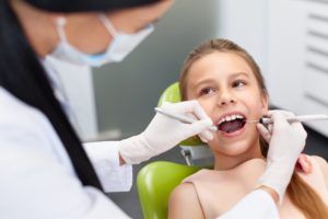 A young girl at her dental exam.